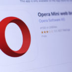 Opera Mini web browser app in play store. close-up on the laptop screen