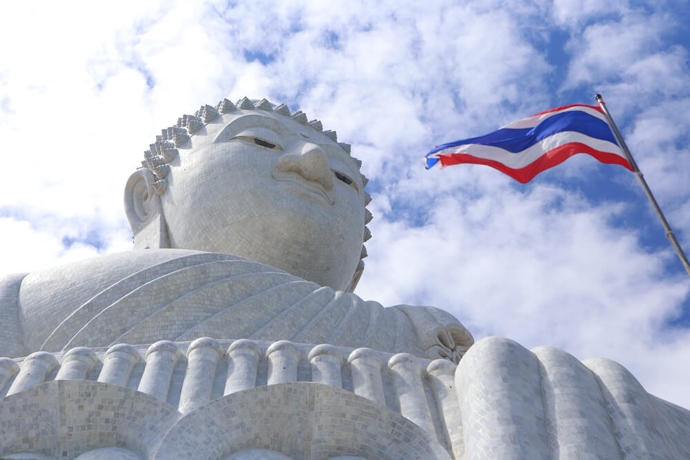 The flag of Thailand flies in front of the Phra Puttamingmokol Akenakkiri Buddha, known as the Big Buddha (1)
